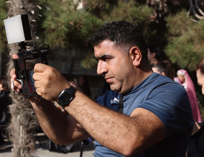 Handheld camera on a developing story